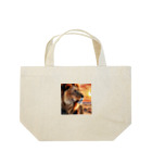 nigihayahiの夕日を背景に威厳あるライオンの姿。 Lunch Tote Bag