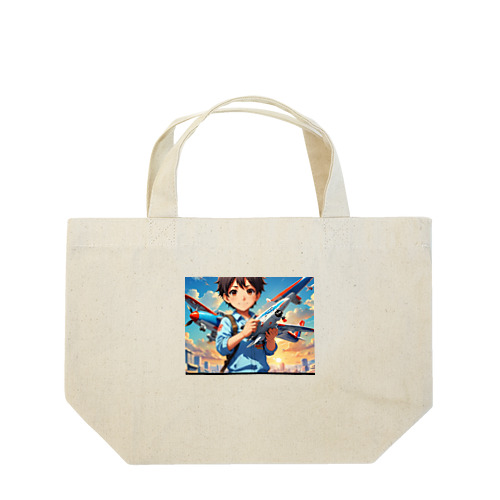 空を駆けるかっこいい飛行機模型を手にした子供 Lunch Tote Bag