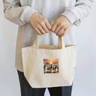 nigihayahiの夕焼けを走るシマウマ Lunch Tote Bag