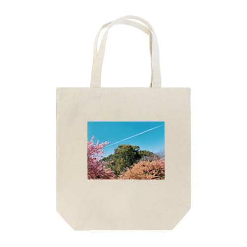 木と桜と飛行機雲とカラス Tote Bag