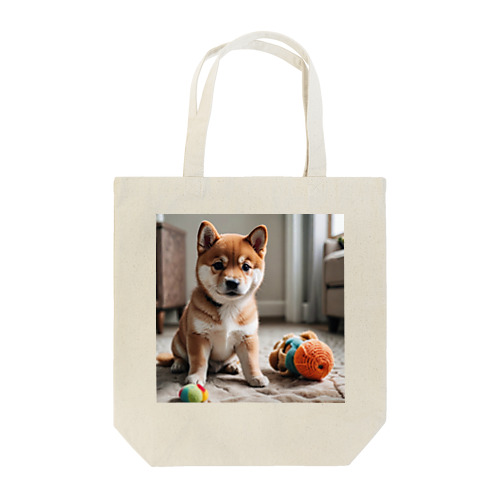 柴犬のかわいい幼子が写真の中央にいる。 Tote Bag