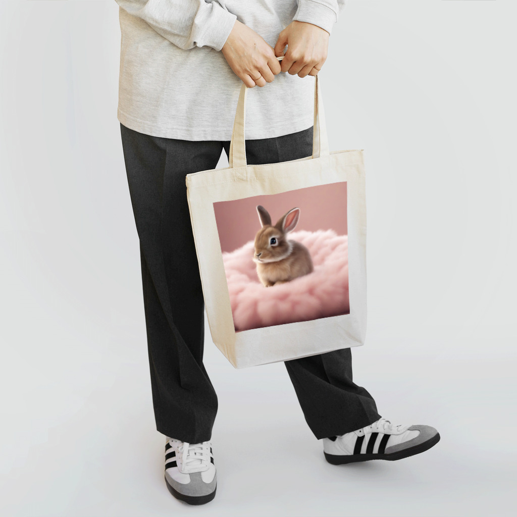 キャリーのふわふわのクッションで遊ぶウサギの赤ちゃん Tote Bag