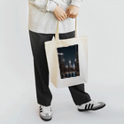 Chop Storeの夜に輝くビル Tote Bag