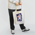 ドーナツ大好きにゃんこの宇宙でドーナツを食べる猫 Tote Bag