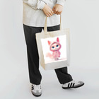 TomaTracksのピンクのパーカーをまとったクールな猫 Tote Bag