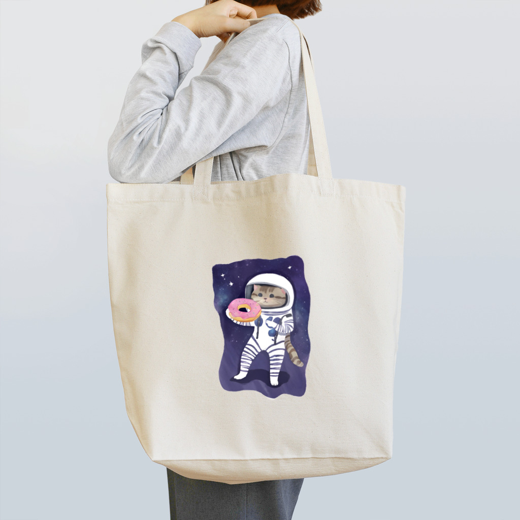 ドーナツ大好きにゃんこの宇宙でドーナツを食べる猫 Tote Bag