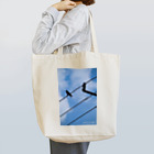 トシタジマの店の青空カラス Tote Bag